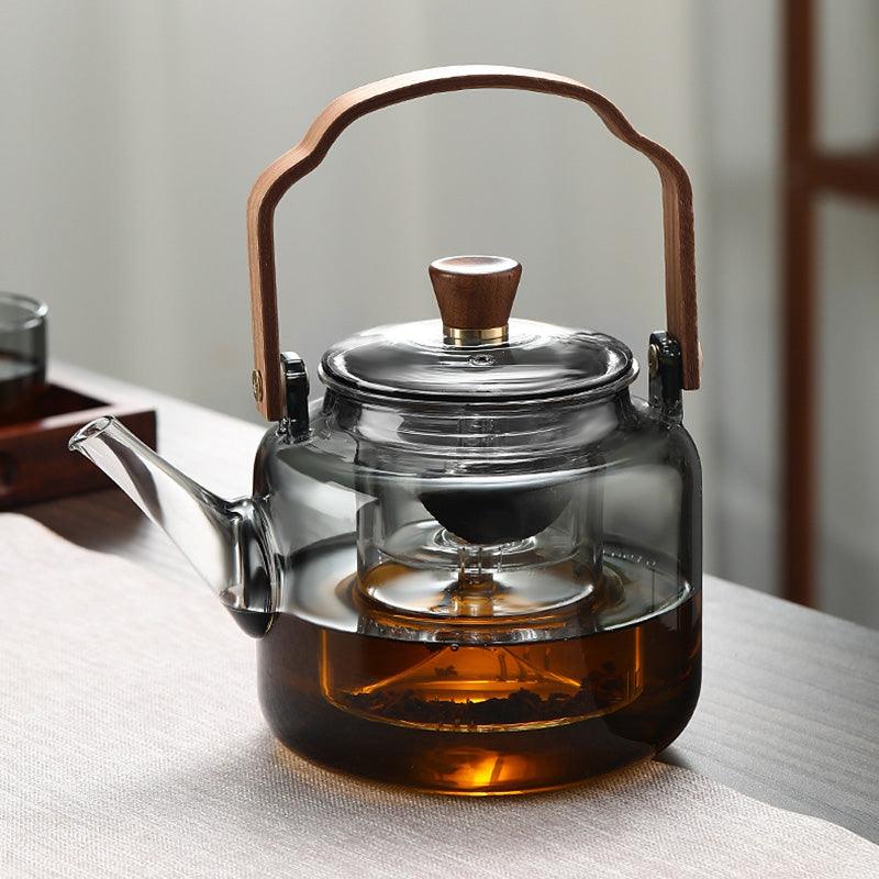 Théière de cuisine 1,2L en verre borosilicate avec des accents en bois, pour infusion optimale.