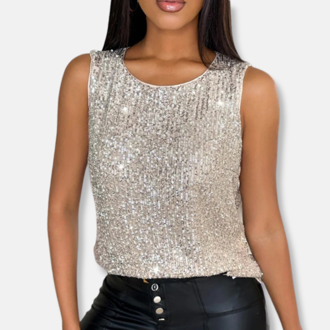Élégant top de soirée femme en sequins blancs, sans manches, parfait pour un look festif et mode féminine.