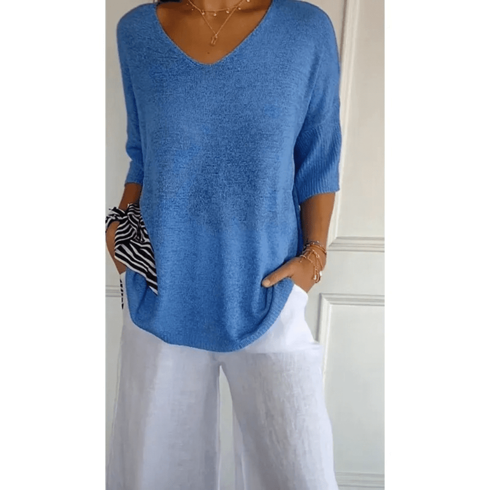 Haut femme décontracté à col V et manches 3/4. Parfait pour une tenue quotidienne élégante et confortable.