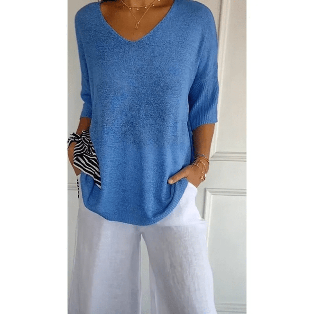 Haut femme décontracté à col V et manches 3/4. Parfait pour une tenue quotidienne élégante et confortable.