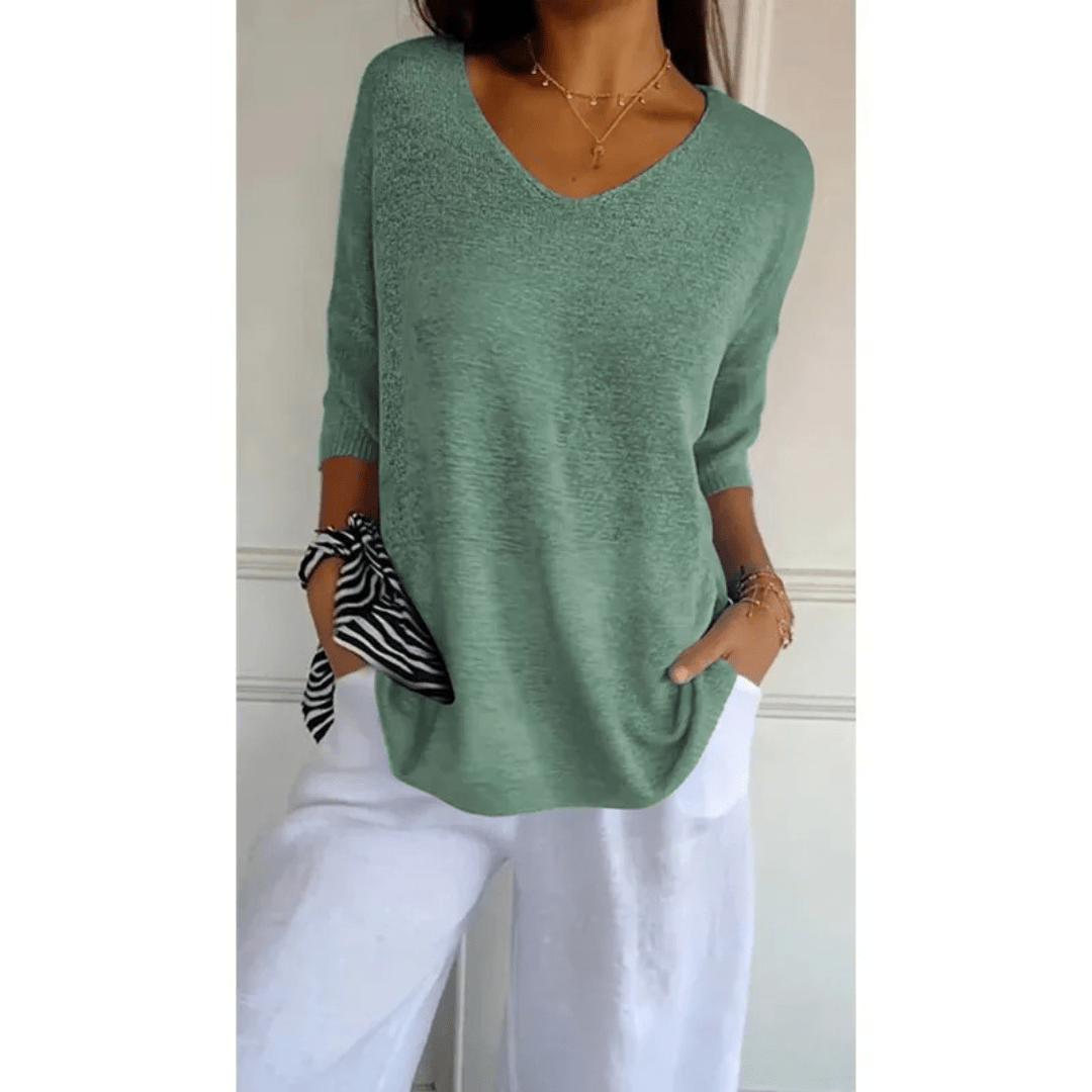 Top femme col V à manches 3/4. Élégance et confort pour votre garde-robe quotidienne. Idéal mi-saison.