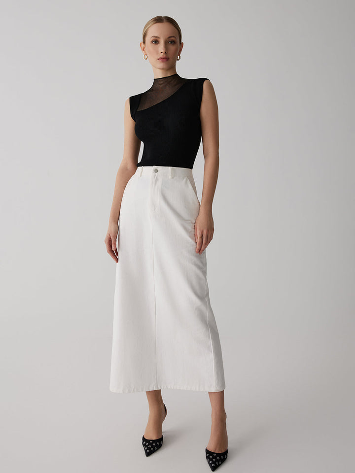 Haut femme beige élégant sans manches, col montant semi-transparent. Chic et moderne pour soirée ou casual.