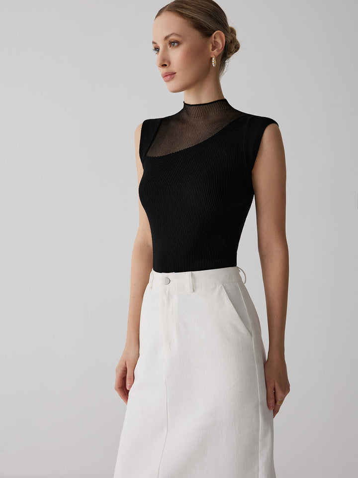 Haut femme noir chic à col montant semi-transparent. Modèle ajusté sans manches, idéal mode soirée.
