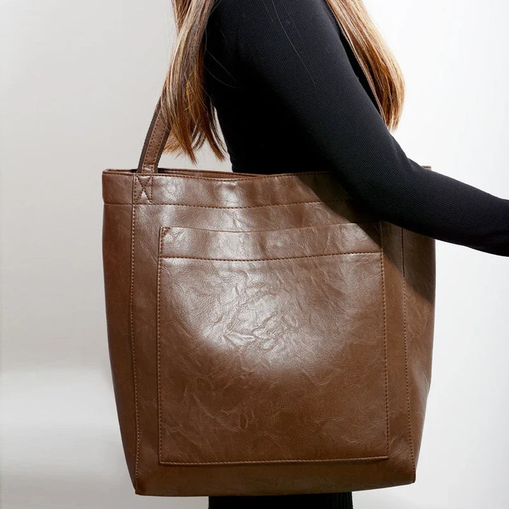 Sac cabas pratique en cuir PU, design moderne et chic, idéal pour la femme active.