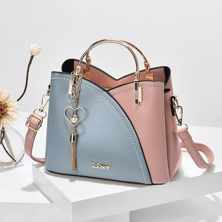 Sac fourre-tout en cuir pour femme, chic et moderne, doté d'une bandoulière, idéal pour une organisation élégante.