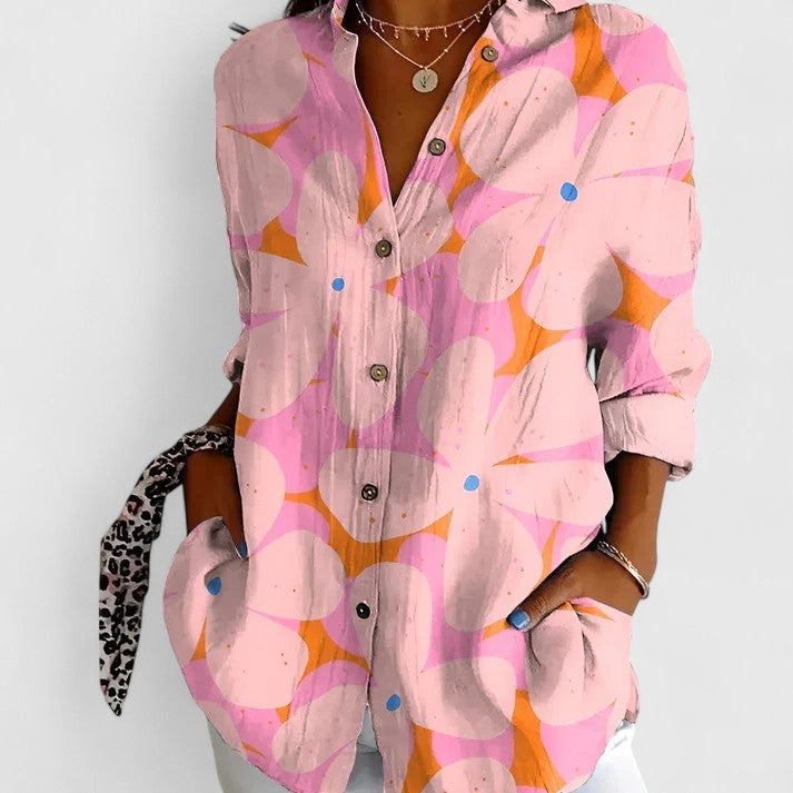 Top femme à fleurs, confortable et polyvalent. Idéal comme vêtement printemps/été. Style élégant.