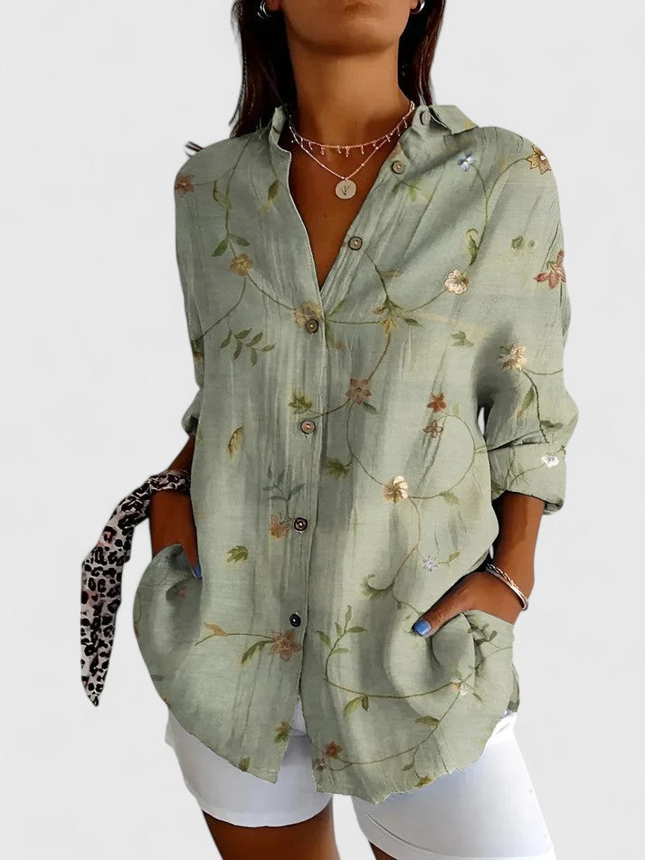 Blouse élégante pour femme avec motifs floraux vifs. Un chemisier lumineux pour un style chic et décontracté.