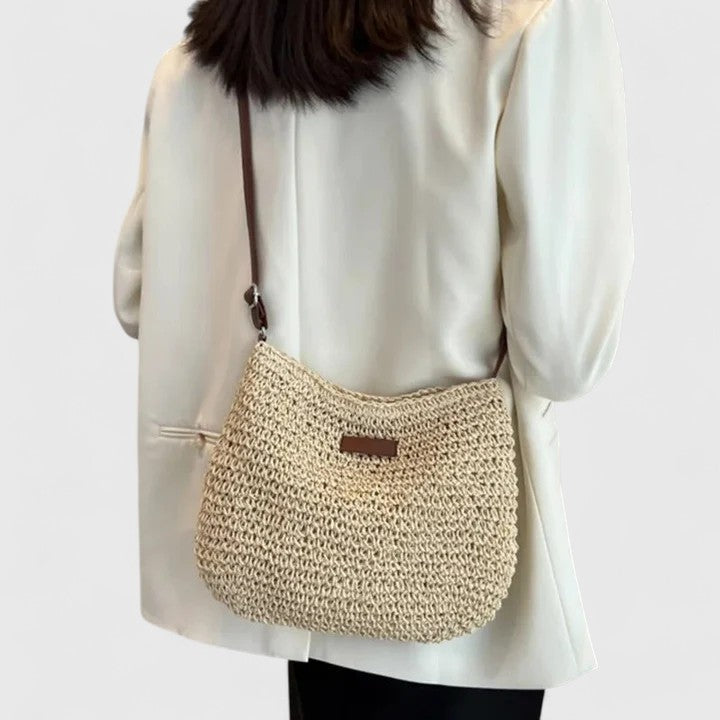 Sac à main femme demi-lune en raphia tressé, bandoulière réglable, style bohème estival.