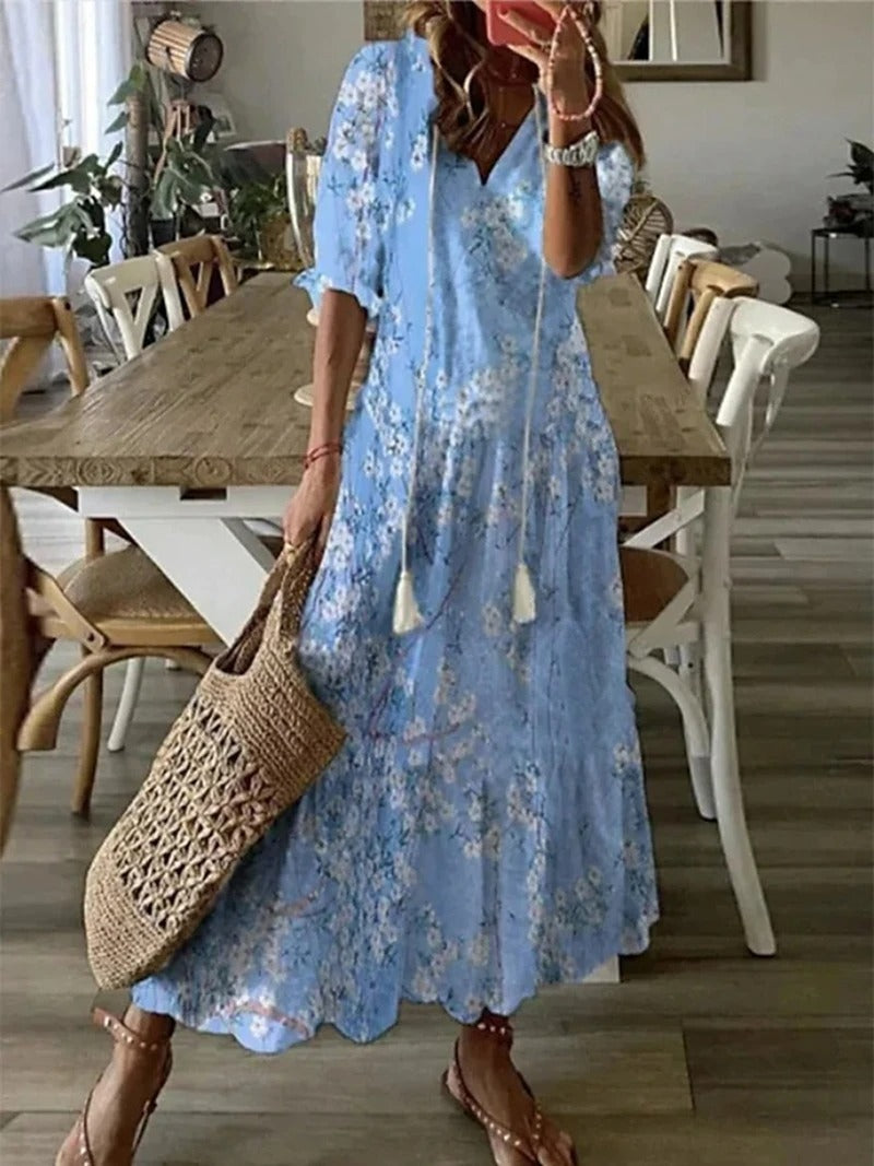 Robe longue bohème femme à motif floral, fluide et légère, idéale pour un look estival chic et décontracté.