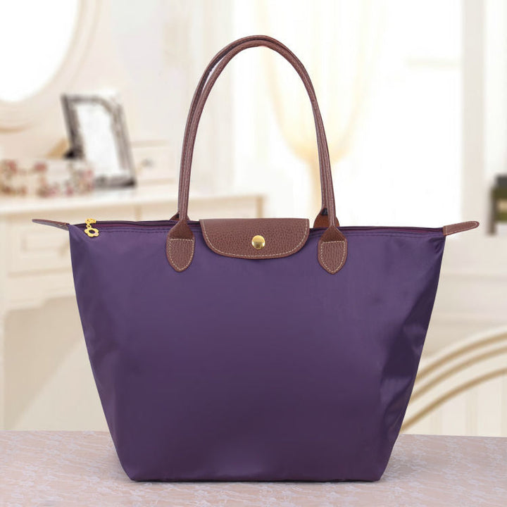 Sac à bandoulière femme Oxford pour un look élégant et un confort optimal au quotidien. Très polyvalent.