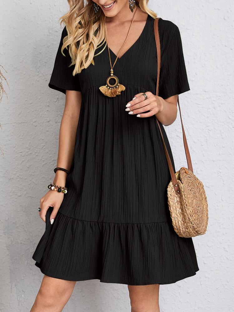 Robe femme coupe fluide et effet drapé élégant, un vêtement confortable pour le quotidien.