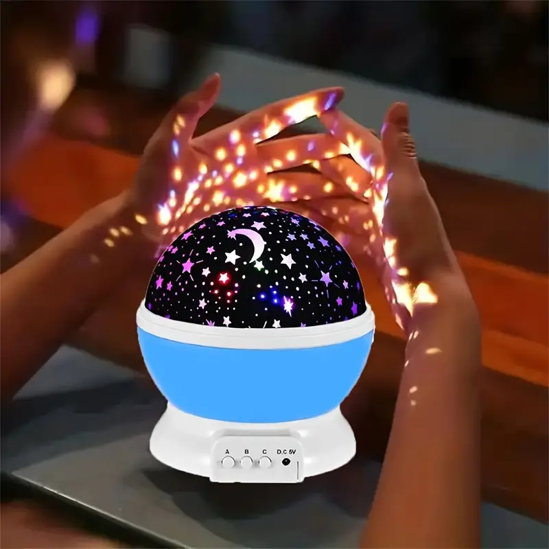 Veilleuse musicale pour bébé, projecteur d'étoiles multicolore, décor et ambiance lumineuse et sonore.