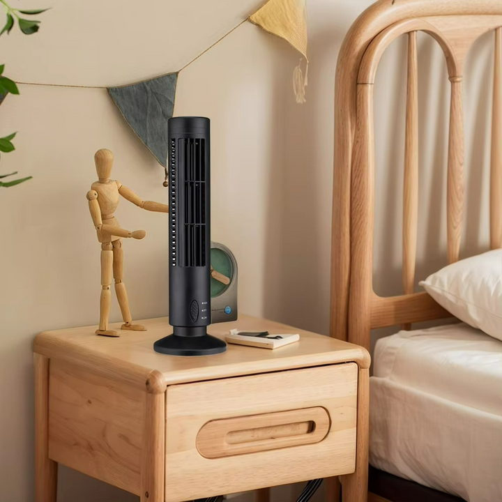 Ventilateur colonne design, noir, compact, pour un flux d'air frais discret et moderne dans votre salon.