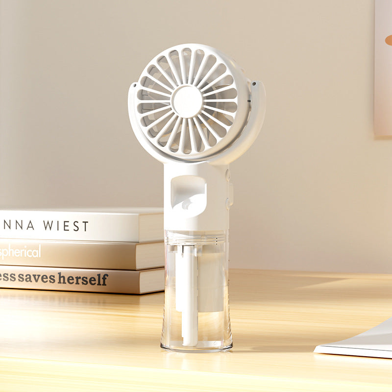 Brumisateur ventilateur main violet silencieux pour femme, parfait pour une fraîcheur hydratante compacte et discrète.