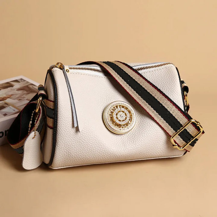 Sac à main Boston en cuir véritable, finitions élégantes, accessoire de mode pour femme moderne.