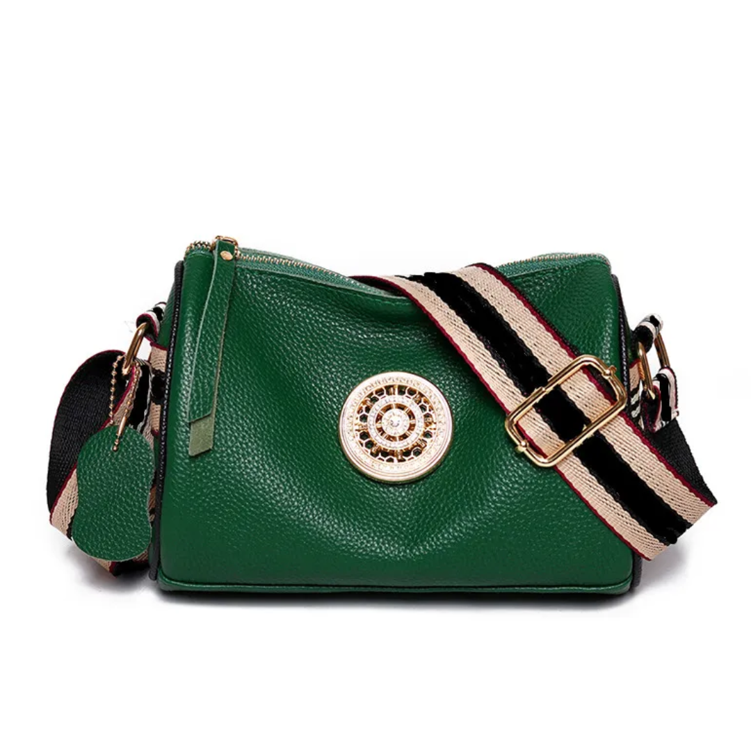 Sac Boston pratique en cuir, couleur kaki, avec compartiments pour organiser vos essentiels féminins.