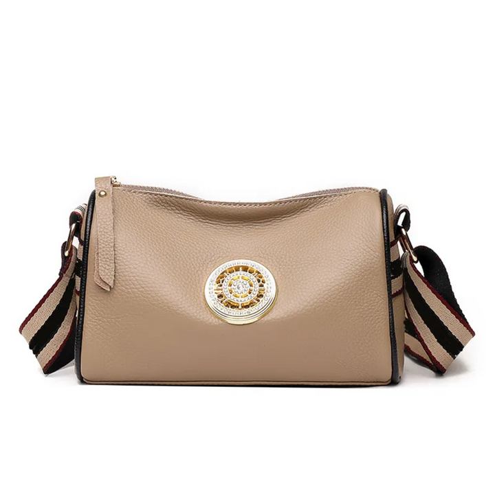 Sac Boston kaki élégant en cuir pour femme, parfait pour le quotidien chic et pratique.