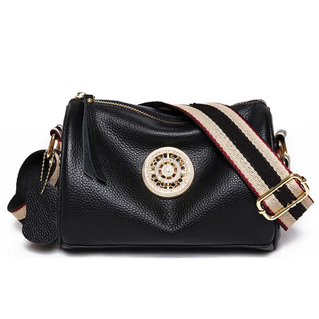 Sac femme Boston noir en cuir, design chic et intemporel, idéal pour un look élégant.