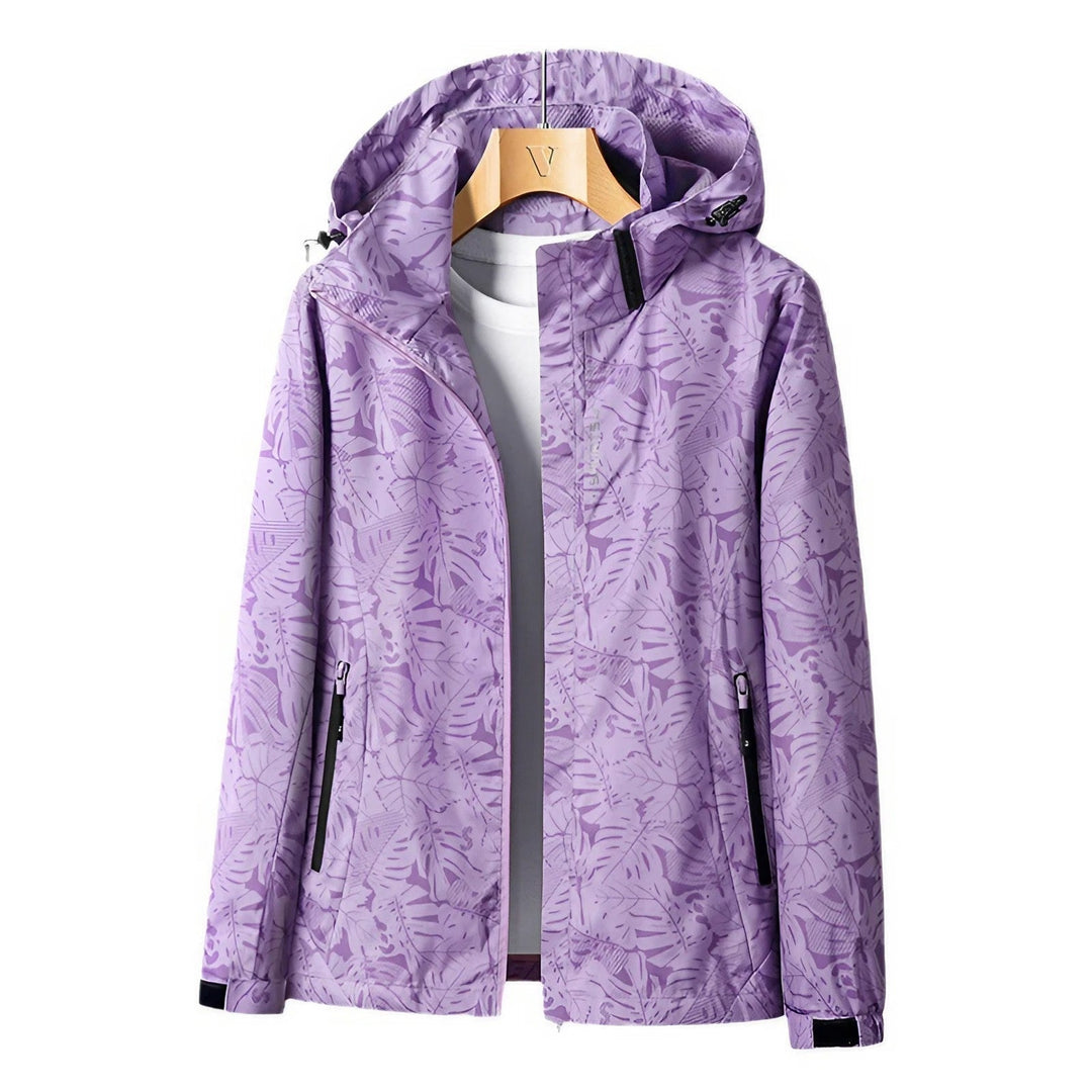 Veste de loisirs femme à capuche avec fermeture éclair et imprimé floral coloré.