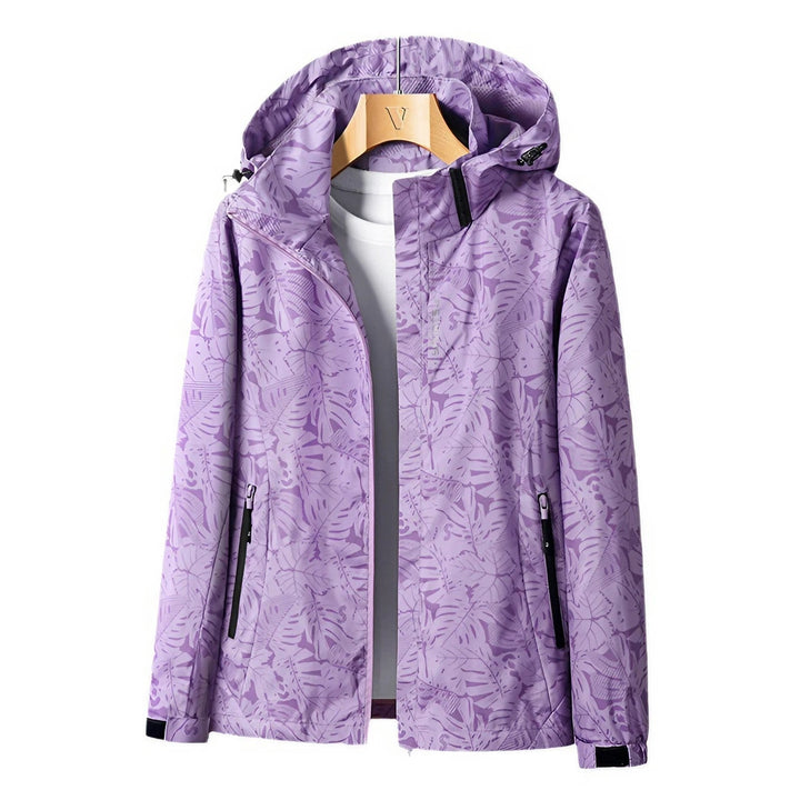 Veste de loisirs femme à capuche avec fermeture éclair et imprimé floral coloré.