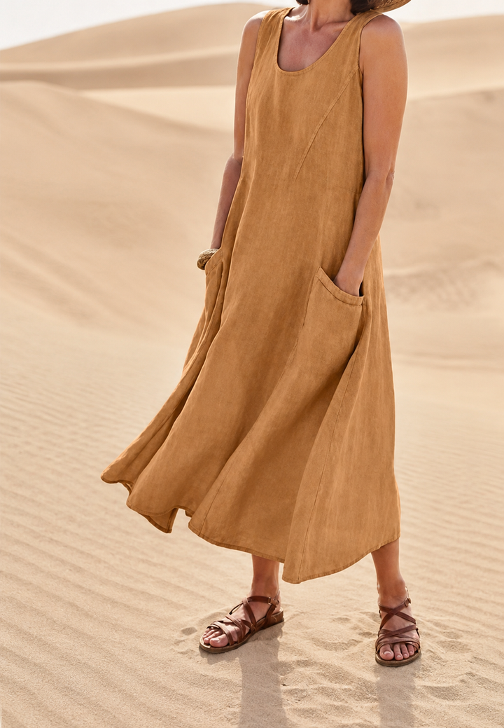 Robe fluide femme, longue et sans manches, avec poches. Vêtement confortable et chic pour l'été.