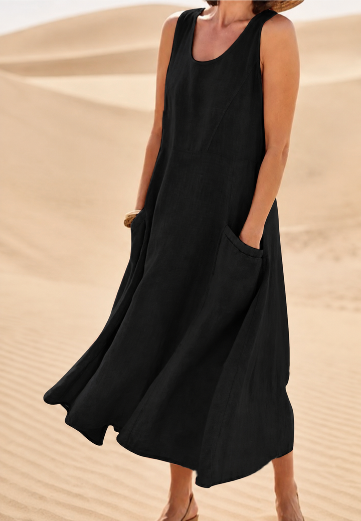Robe longue fluide femme sans manches, confortable avec poches. Idéale pour l'été et un look décontracté bohème.