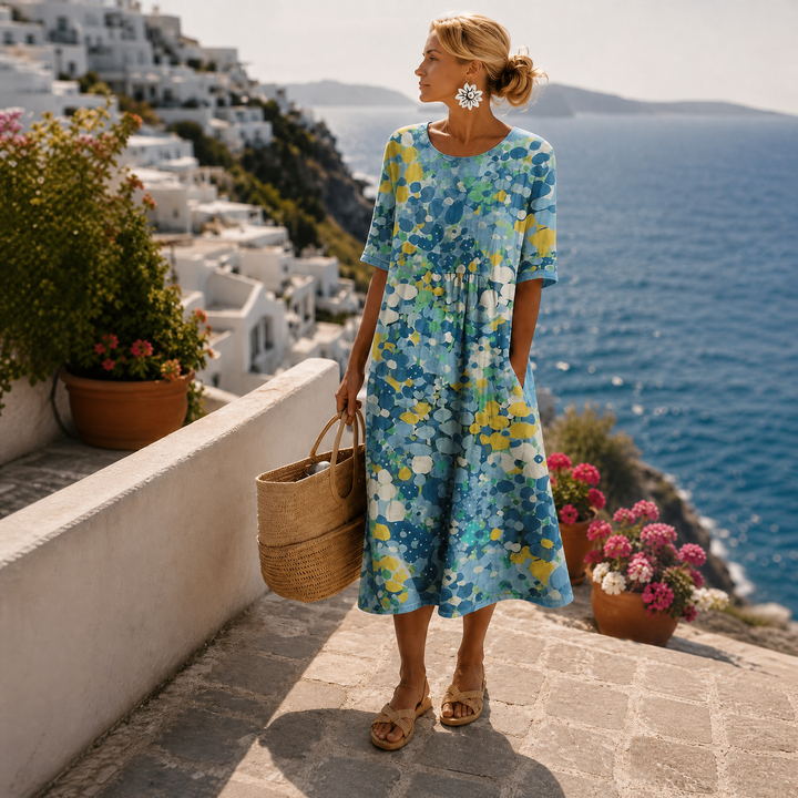 Robe d'été florale midi décontractée pour femme. Idéale pour les vacances, avec son style léger et son imprimé.