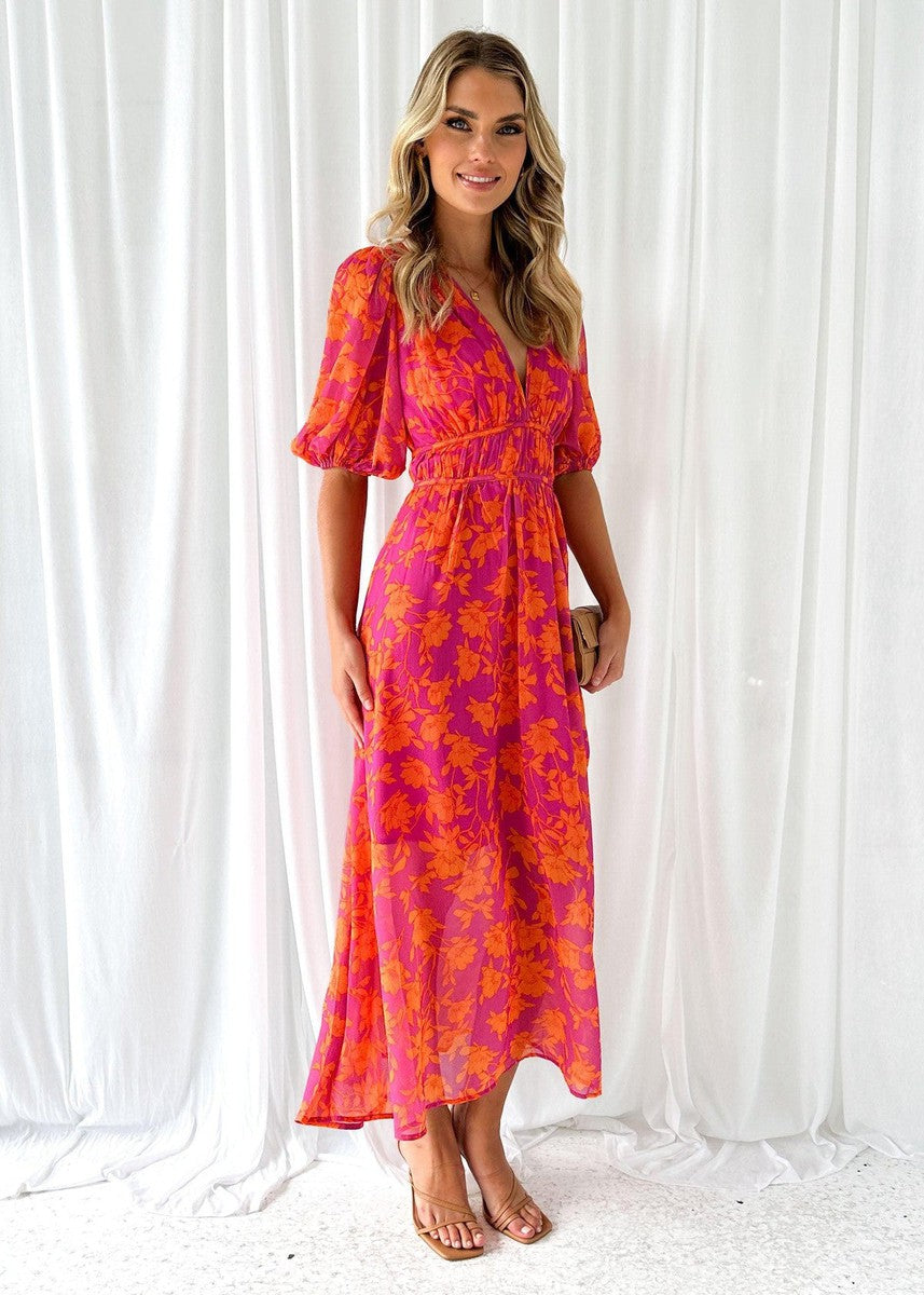 Élégante robe midi florale pour femme, idéale pour le printemps et l'été, avec ses manches bouffantes et son imprimé.