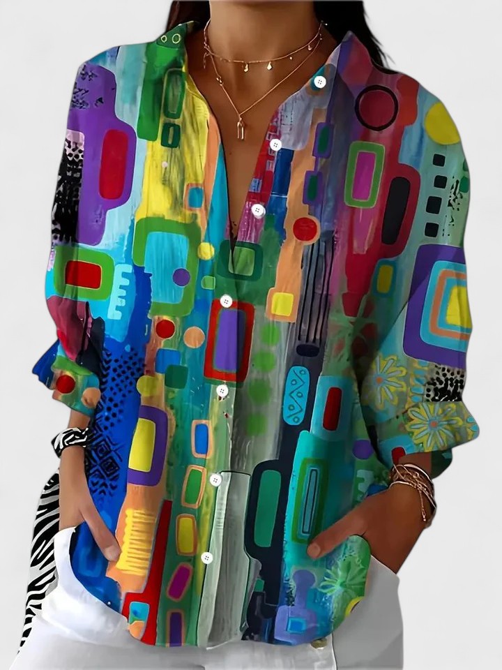 Blouse femme élégante à motif géométrique, parfaite pour un look chic et moderne au bureau ou en ville.