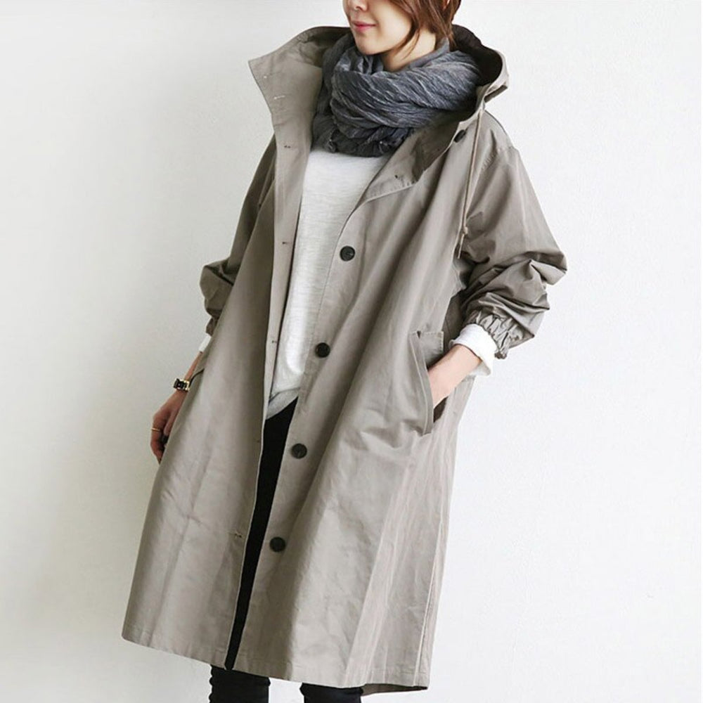 Veste de pluie chic pour femme, trench-coat imperméable et élégant, parfait pour la mode urbaine.