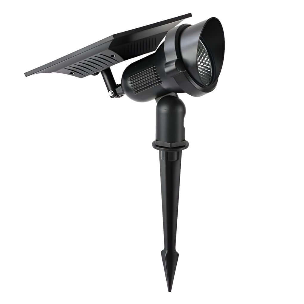 Vue de dessus du spot solaire LED orientable, prêt à être installé dans un massif floral.