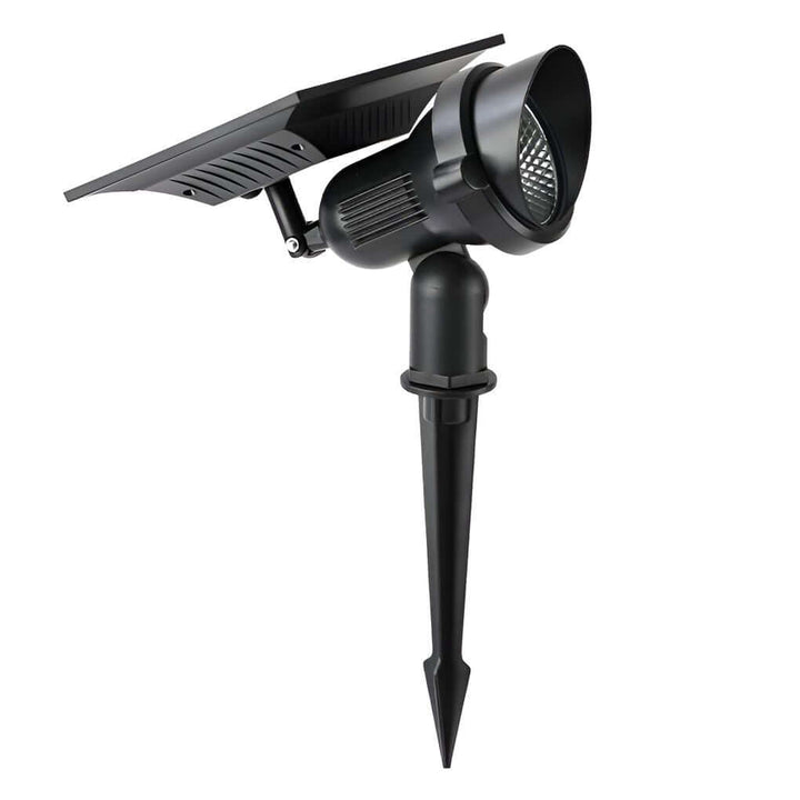 Vue de dessus du spot solaire LED orientable, prêt à être installé dans un massif floral.