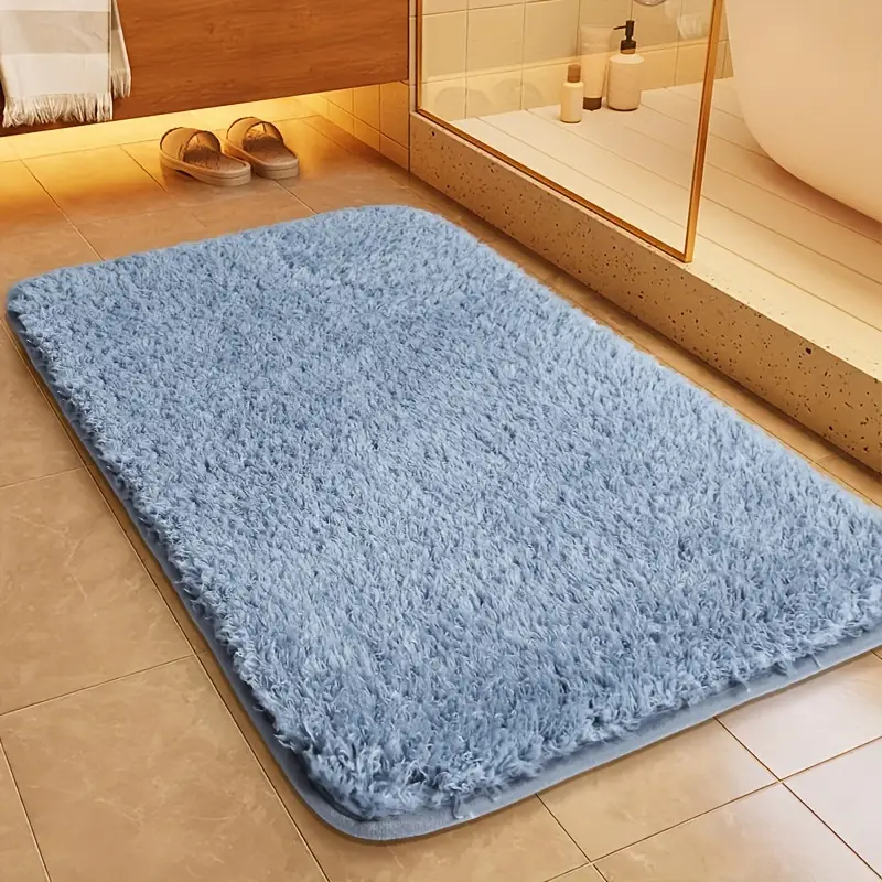 Tapis de bain rectangulaire ultra-moelleux, offre un confort absolu et doux sous les pieds.