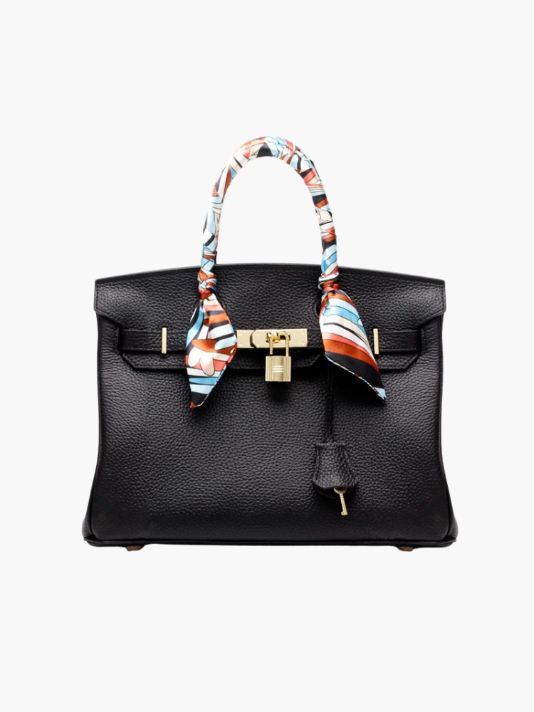 Sac à main classique en cuir, robuste et raffiné, un essentiel pour toute femme.