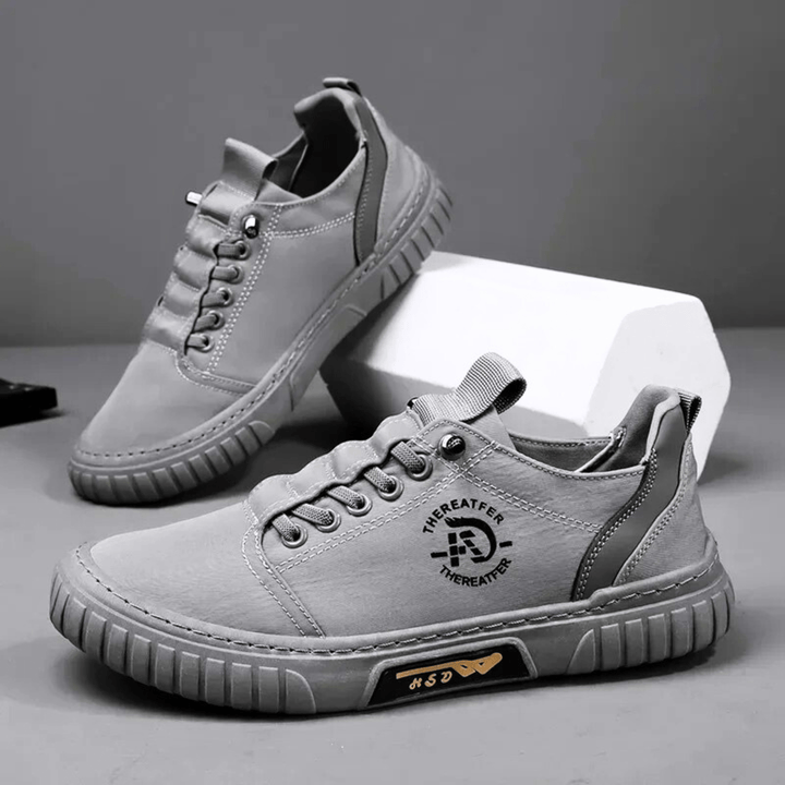Baskets homme avec semelle épaisse blanche contrastante, idéales pour un look décontracté et un confort urbain.