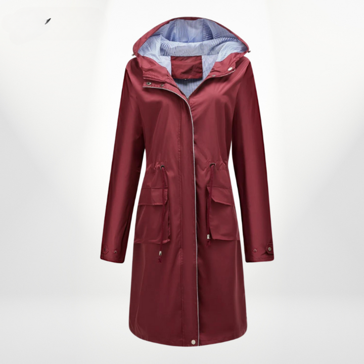 Veste longue de pluie Freida pour femme, coupe chic et imperméable. Capuche et taille ajustable pour un look élégant.