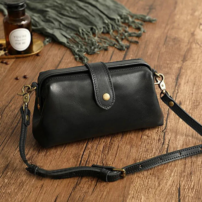 Sac bandoulière orange Amber en cuir véritable pour femme. Accessoire luxe polyvalent.