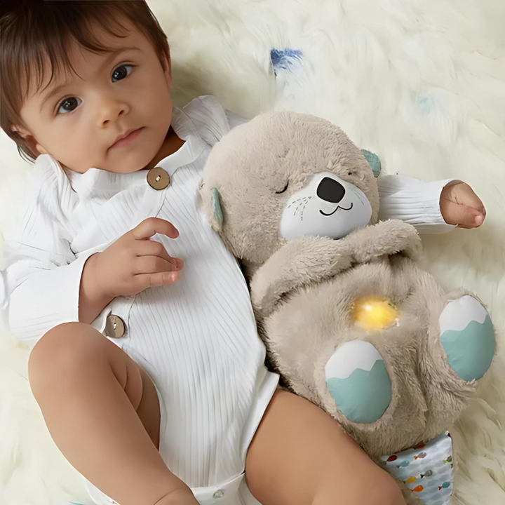 Peluche apaisante Ami Câlin avec veilleuse douce et sons relaxants pour le sommeil de bébé et enfant.
