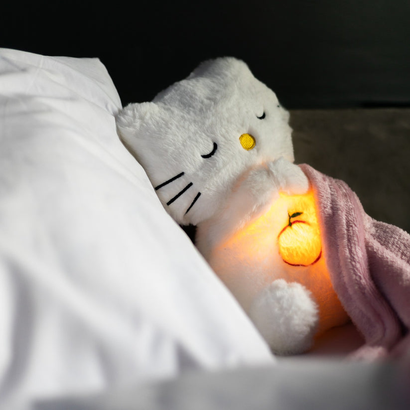 Peluche lapin Ami Câlin, doudou avec veilleuse douce et musiques relaxantes pour le sommeil de l'enfant.