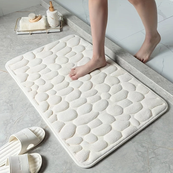 Tapis de bain antidérapant pour salle de bain, assure sécurité et confort après la douche.