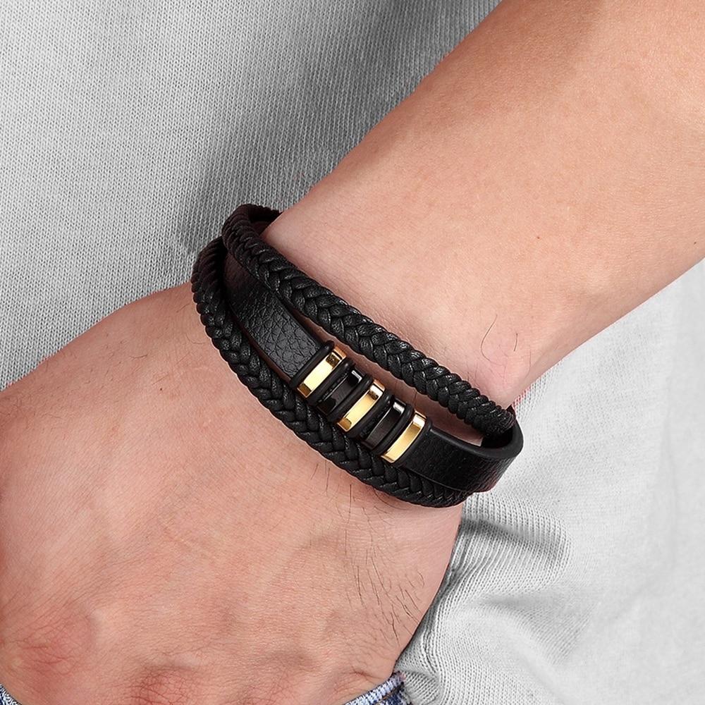 Bracelet en cuir noir, tressé, avec fermoir magnétique pour hommes. Accessoire mode durable.
